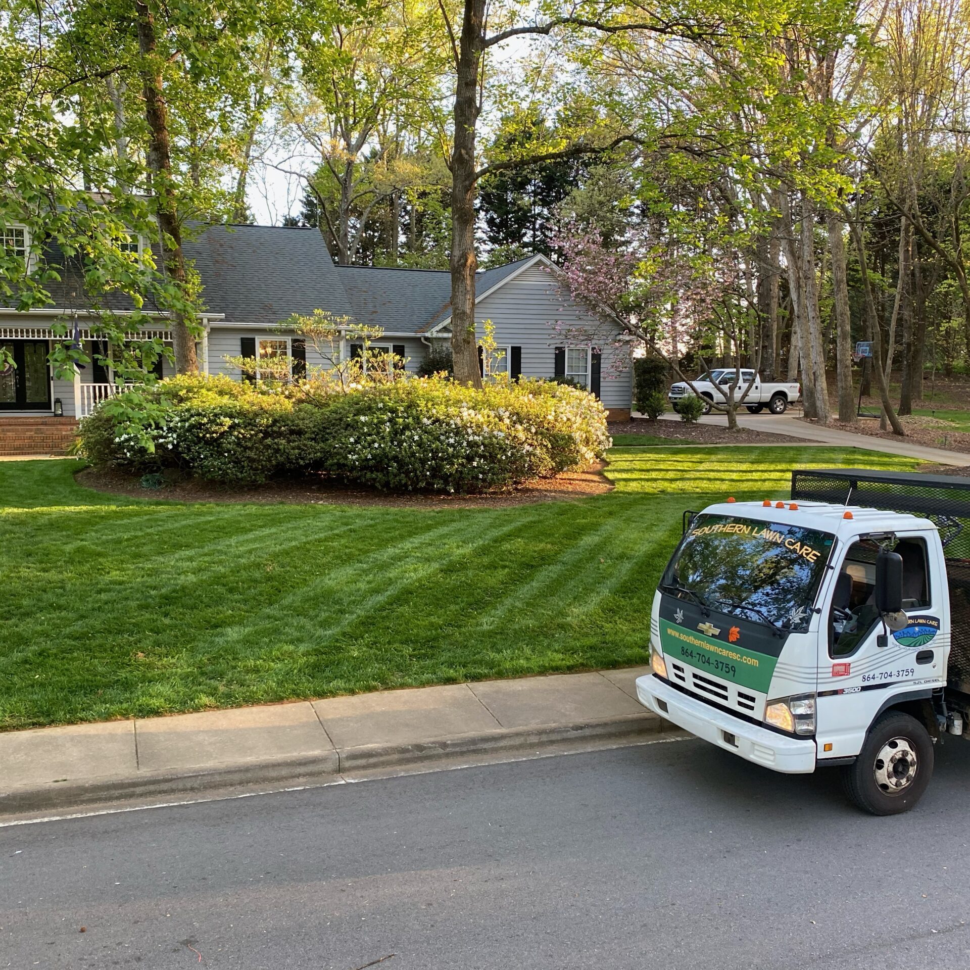 Southern Lawn Care truck Southern Lawn Care truck parked in front of home with nice landscaping